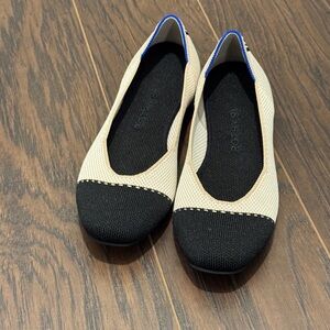Rothy's Black and Cream Flats with Blue Accent